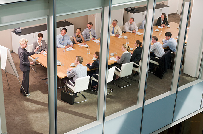 A large business meeting in a board room