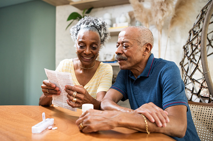 Senior couple looking at prescription directions